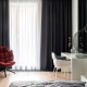 Dark curtains in the bedroom interior